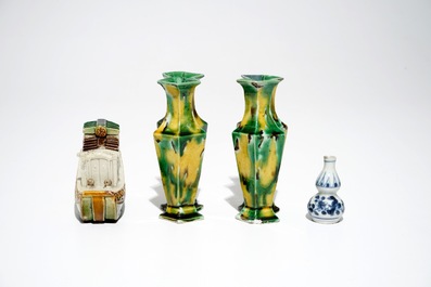 A pair of spinach and egg lozenge-shaped vases, a verte biscuit model of a boat and a miniature vase, Kangxi