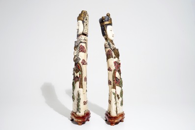 A pair of tall Chinese polychrome ivory figures, early 20th C.
