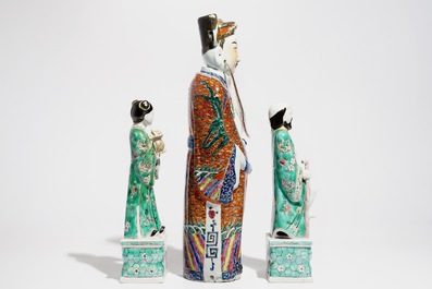 A Chinese famille rose figure of an immortal and a pair of famille verte figures, 19/20th C.