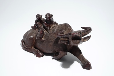 A Chinese wooden model of an ox and a wooden tray with silver handles, 19th C.