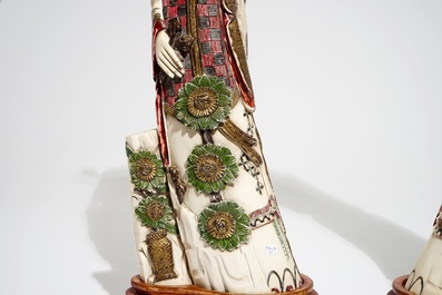 A pair of tall Chinese polychrome ivory figures, early 20th C.