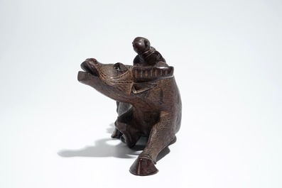 A Chinese wooden model of an ox and a wooden tray with silver handles, 19th C.