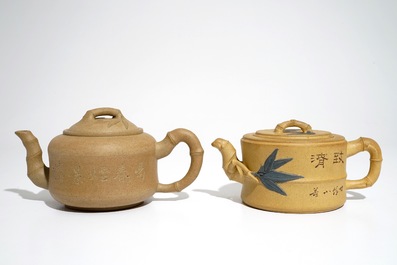 Two Chinese sand-coloured Yixing stoneware teapots, 20th C.