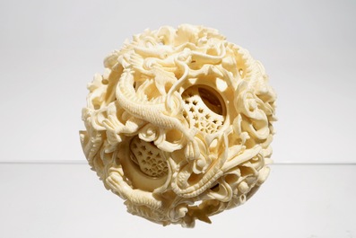 Two Chinese Canton ivory puzzle balls on stands and a figure of a sage, 19th C.