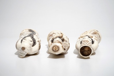 Three signed Japanese ivory okimono of bearded sages, Meiji, early 20th C.