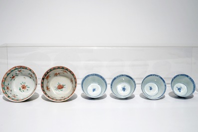 A pair of Chinese famille verte cups and saucers and four blue and white cups, Kangxi