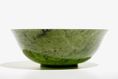 A Chinese thin-walled spinach green jade bowl, 20th C.