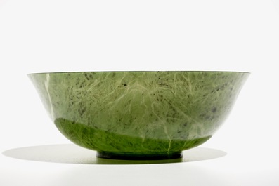 A Chinese thin-walled spinach green jade bowl, 20th C.