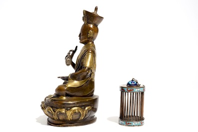 A Chinese bronze model of a seated Buddha and a cloisonn&eacute; cricket case, 19/20th C.