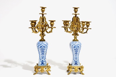 A pair of Chinese blue and white gilt bronze-mounted candelabra vases, Kangxi