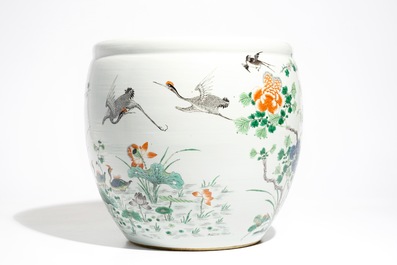 A Chinese famille verte fish bowl with a phoenix and mandarin ducks, 19th C.