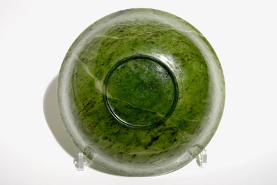 A Chinese thin-walled spinach green jade bowl, 20th C.