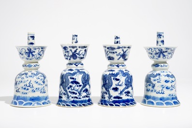 Two pairs of Chinese blue and white candlesticks with dragons, 19/20th C.