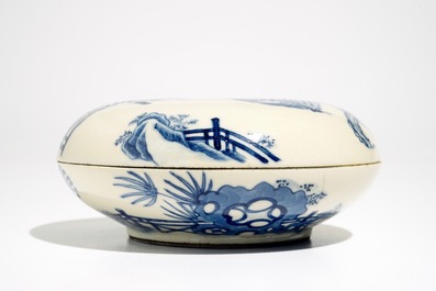 A round Chinese blue and white soft paste box and cover, Kangxi mark, 19th C.