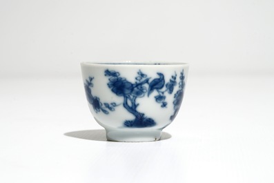 A set of five Chinese blue and white cups and saucers with birds among flowers, Kangxi