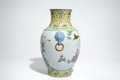A Chinese famille rose hu vase with birds among flowers on rockwork, Qianlong mark, 19/20th C.