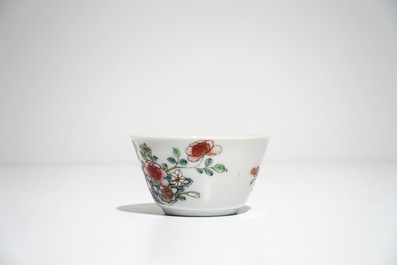 Five Chinese famille rose cups and saucers with vases among flowers, Yongzheng/Qianlong