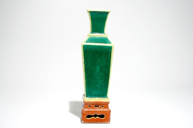 A tapered square Chinese vase on stand in green, yellow and orange, 19/20th C.
