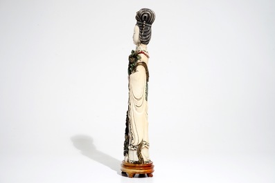 A tall Chinese polychrome ivory model of a lady with removable head, 19th C.