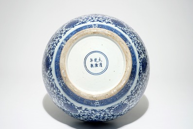 A Chinese blue and white lotus scroll hu vase, Qianlong mark, 19th C.