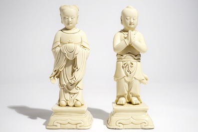 A pair of Chinese blanc de Chine models of a boy and a girl, 20th C.