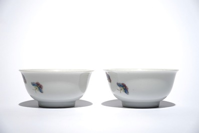 A pair of Chinese famille rose cups with flowers and butterflies, Qianlong mark, 19/20th C.