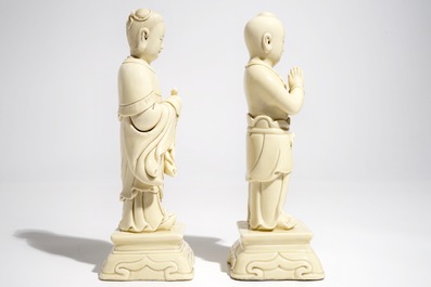 A pair of Chinese blanc de Chine models of a boy and a girl, 20th C.