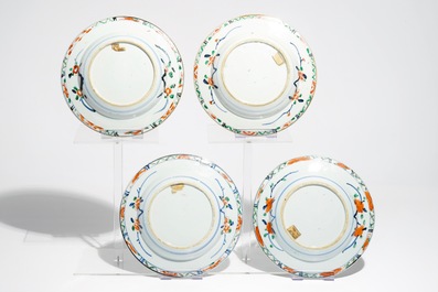 Four Chinese famille verte plates with incised underglaze design and a central flowervase, Kangxi