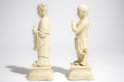 A pair of Chinese blanc de Chine models of a boy and a girl, 20th C.