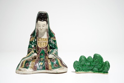 A Chinese verte biscuit model of a Guanyin, Kangxi and a green-glazed brush rest, 19th C.