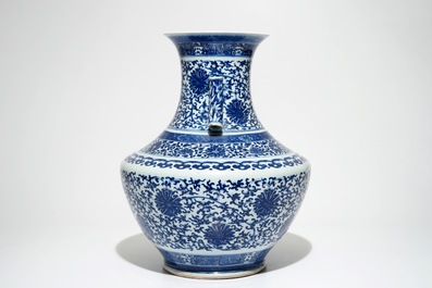 A Chinese blue and white lotus scroll hu vase, Qianlong mark, 19th C.