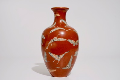 A Chinese coral-ground vase with butterflies, Qianlong mark, 19/20th C.