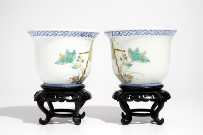 A pair of small Chinese famille rose jardinieres on wooden stands, early 20th C.