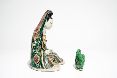 A Chinese verte biscuit model of a Guanyin, Kangxi and a green-glazed brush rest, 19th C.