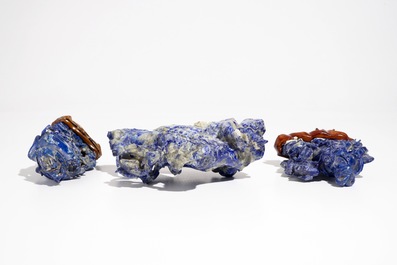 Three Chinese lapis lazuli sculptures on wooden stands, 20th C.