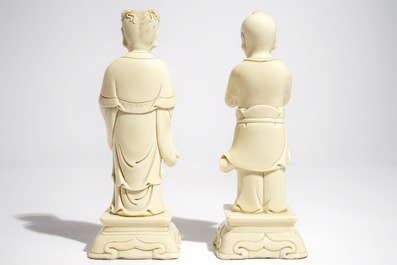 A pair of Chinese blanc de Chine models of a boy and a girl, 20th C.