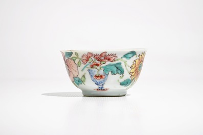 A fine Chinese famille rose cup and saucer with a flowervase, Yongzheng