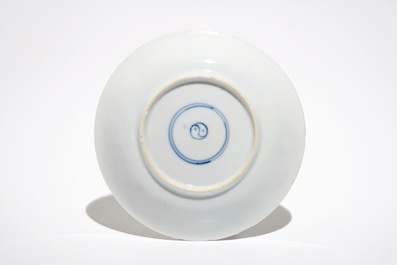 A Chinese famille verte cup and saucer with yin-yang mark, Kangxi