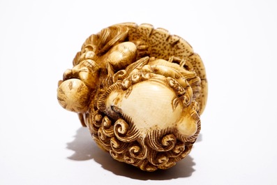 A Japanese laquer inro with ivory netsuke and agate ojime, and a Buddhist lion netsuke, Meiji/Taisho