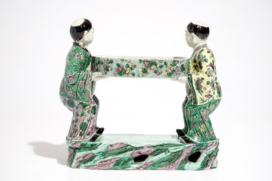 A Chinese verte biscuit group of the Hehe Er Xian brothers holding a tray, 19th C.