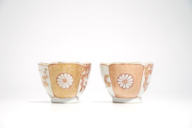 A pair of Chinese milk and blood quatrefoil cups and saucers, Kangxi