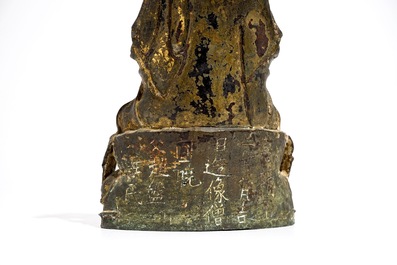 A Chinese inscribed and dated gilt bronze figure of Guanyin, Ming