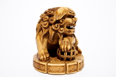 A Japanese laquer inro with ivory netsuke and agate ojime, and a Buddhist lion netsuke, Meiji/Taisho