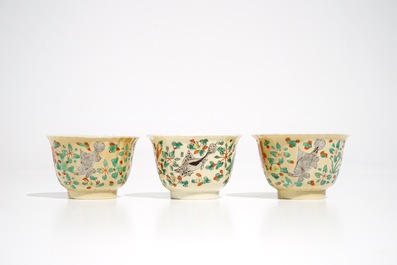Three Chinese famille verte caf&eacute; au lait-ground cups and saucers with crabs and fish, Kangxi