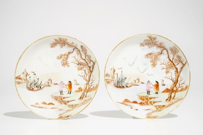 A pair of Chinese Meissen style cups and saucers with a harbour scene, Qianlong