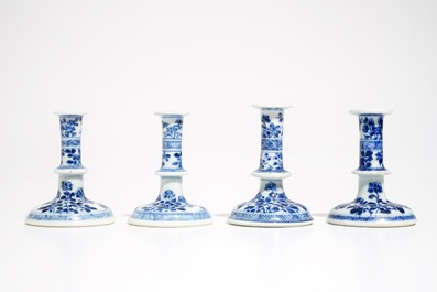 Four small Chinese blue and white floral candlesticks, Kangxi