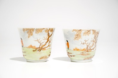 A pair of Chinese Meissen style cups and saucers with a harbour scene, Qianlong