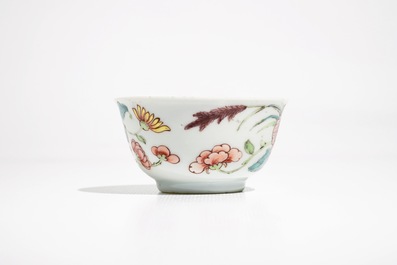 A fine Chinese famille rose cup and saucer with a flowervase, Yongzheng