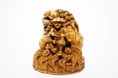 A Japanese laquer inro with ivory netsuke and agate ojime, and a Buddhist lion netsuke, Meiji/Taisho