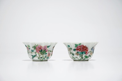 A pair of Chinese lobed famille rose cups and saucers, Yongzheng